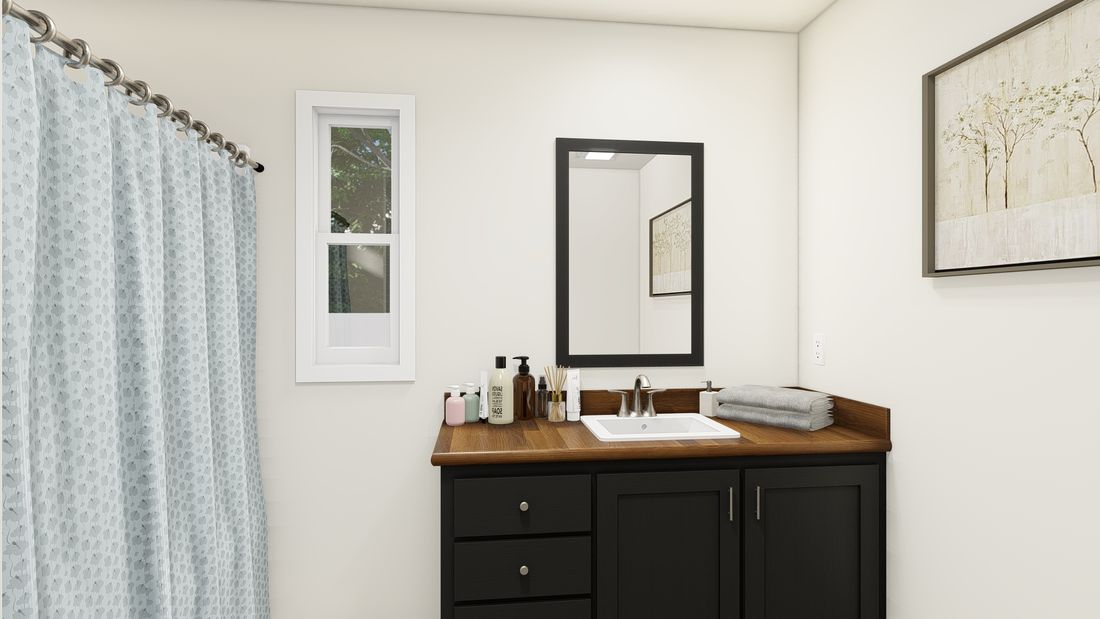 The DRM483F 48' DREAM Primary Bathroom. This Manufactured Mobile Home features 3 bedrooms and 2 baths.