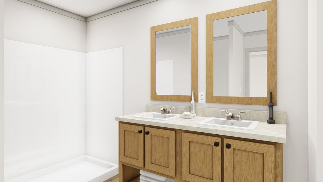 The 1676 SWEET CAROLINE Primary Bathroom. This Manufactured Mobile Home features 3 bedrooms and 2 baths.